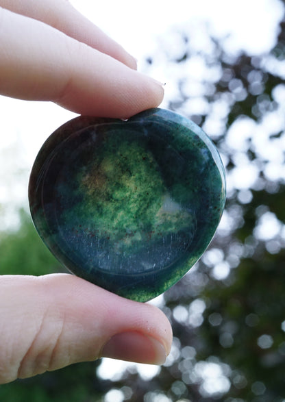 green heart stone against the light