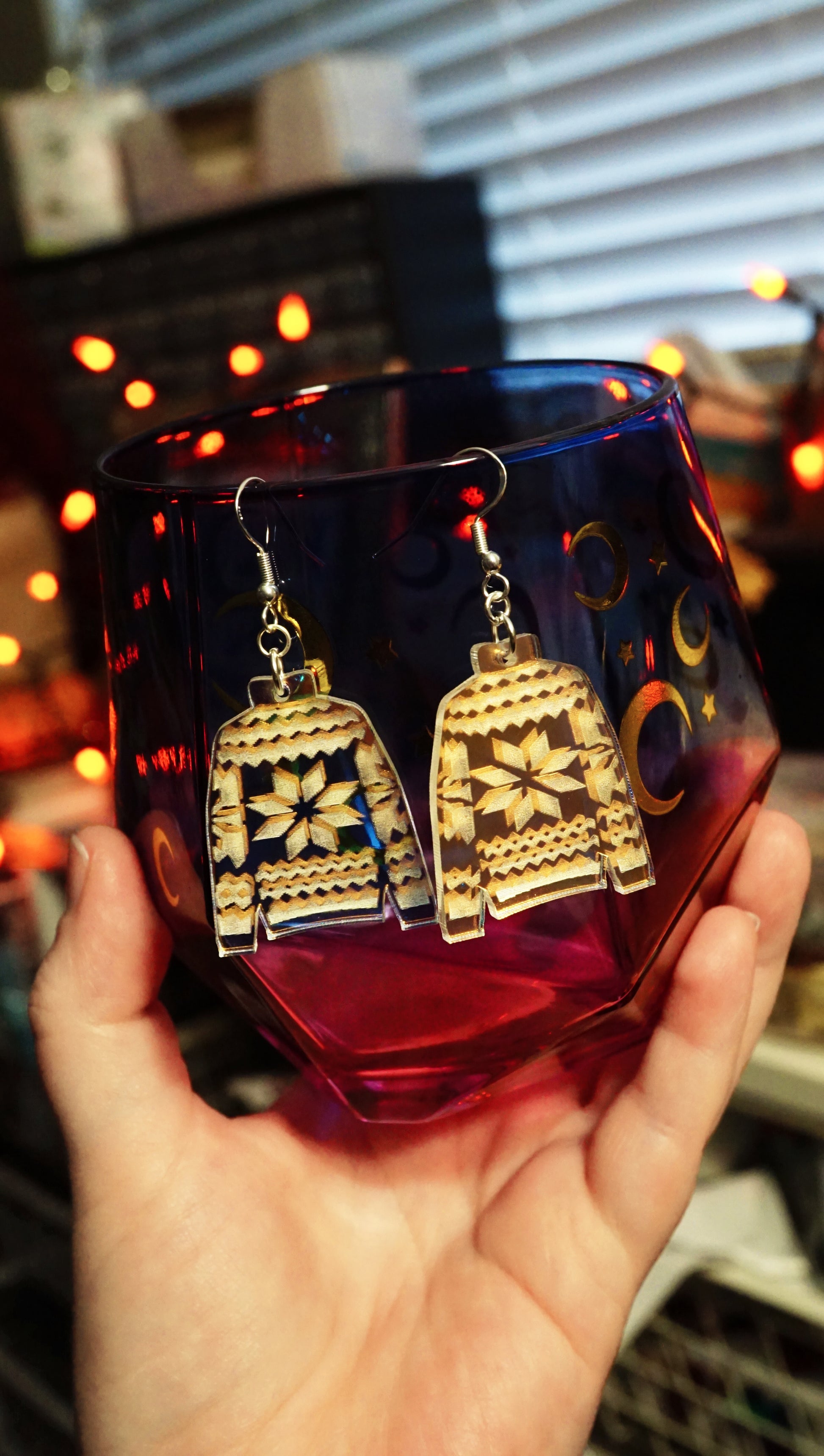 sweater dangles held in hand