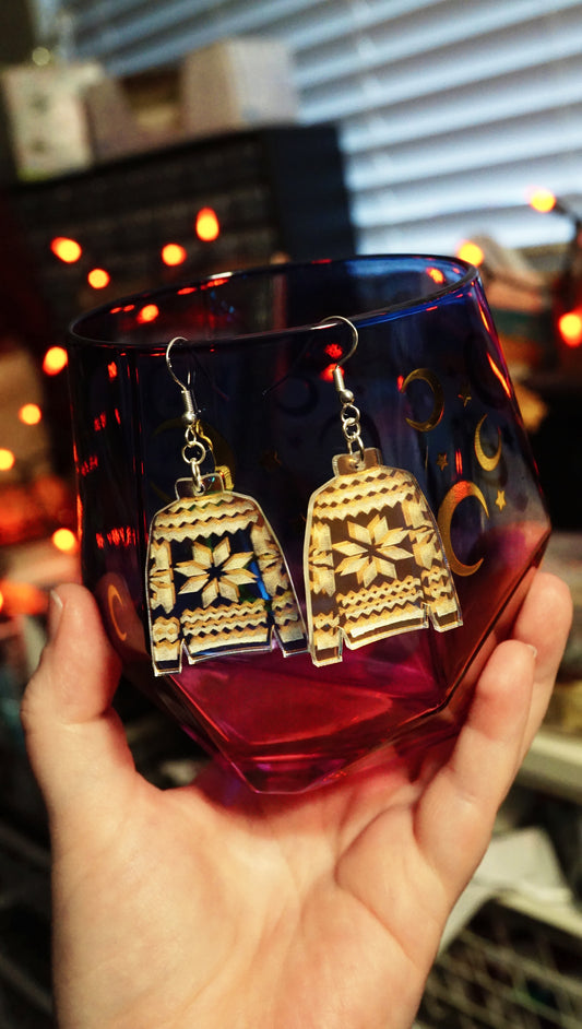 sweater dangles held in hand