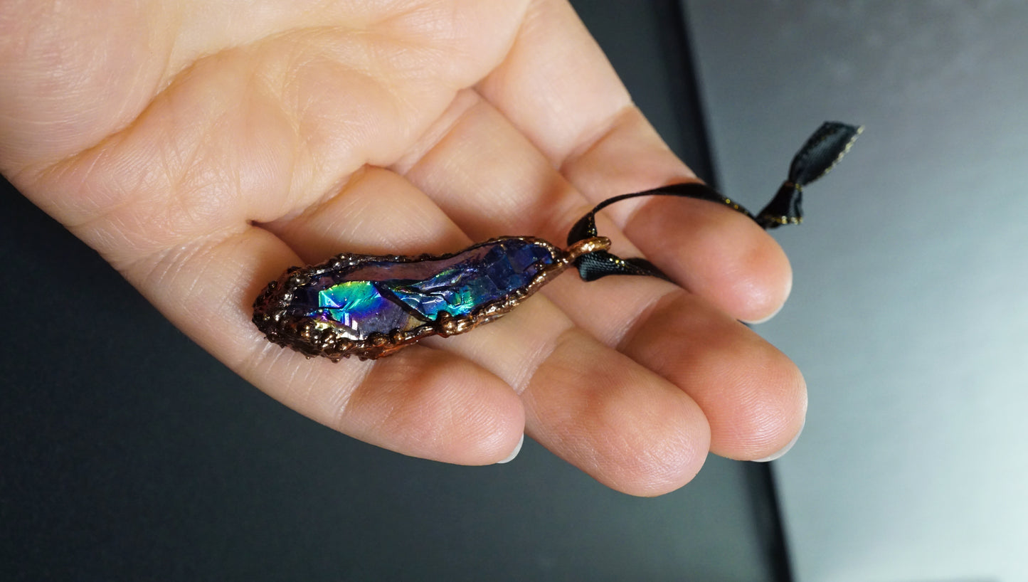 hand holding a colorful ornament