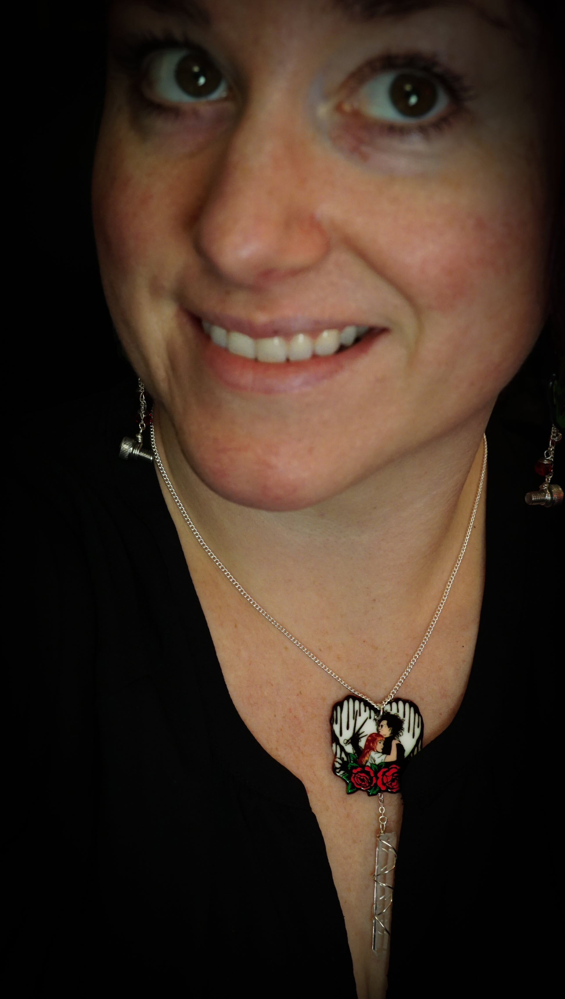woman wearing edward scissorhands necklace with clear quartz. black shirt
